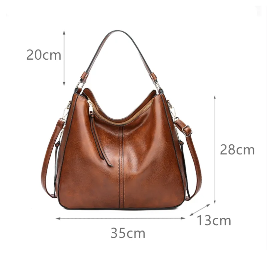 "Elegante rode hobo tas voor dames met vintage charme, ruim interieur, ideaal voor dagelijks gebruik in stijl."