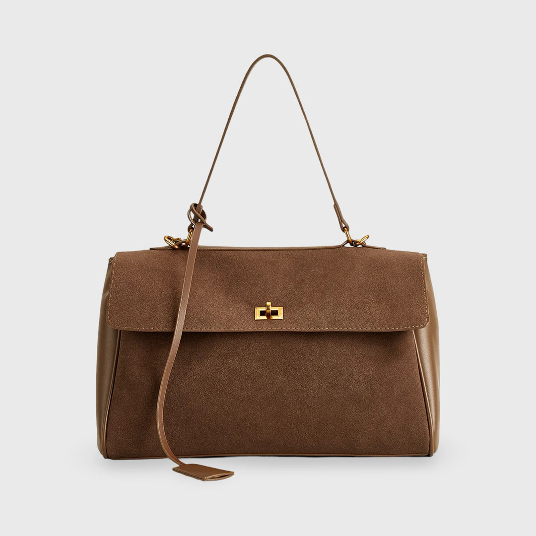 "Elegante suéde schoudertas met vegan leren details, verstelbare riem en goudkleurige hardware, ideaal voor dagelijks gebruik