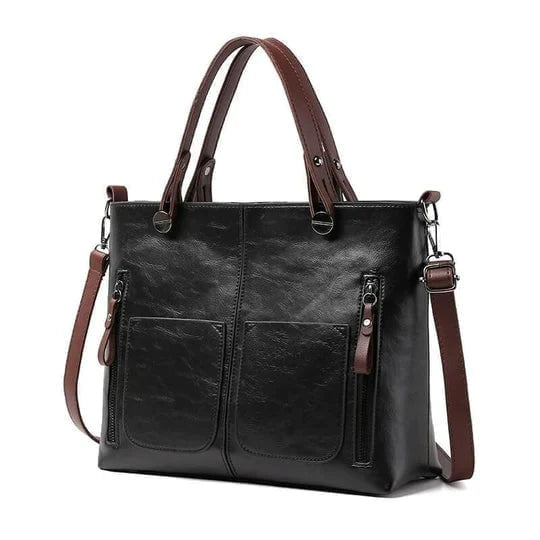"Elegante vintagestijl leren schoudertas voor dames met bruine tinten, perfect voor een klassieke en tijdloze look."