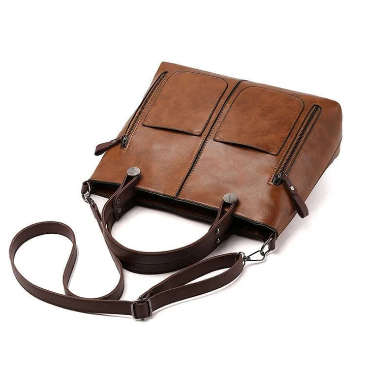 "Elegante vintagestijl leren schoudertas voor dames met bruine tinten, perfect voor een klassieke en tijdloze look."