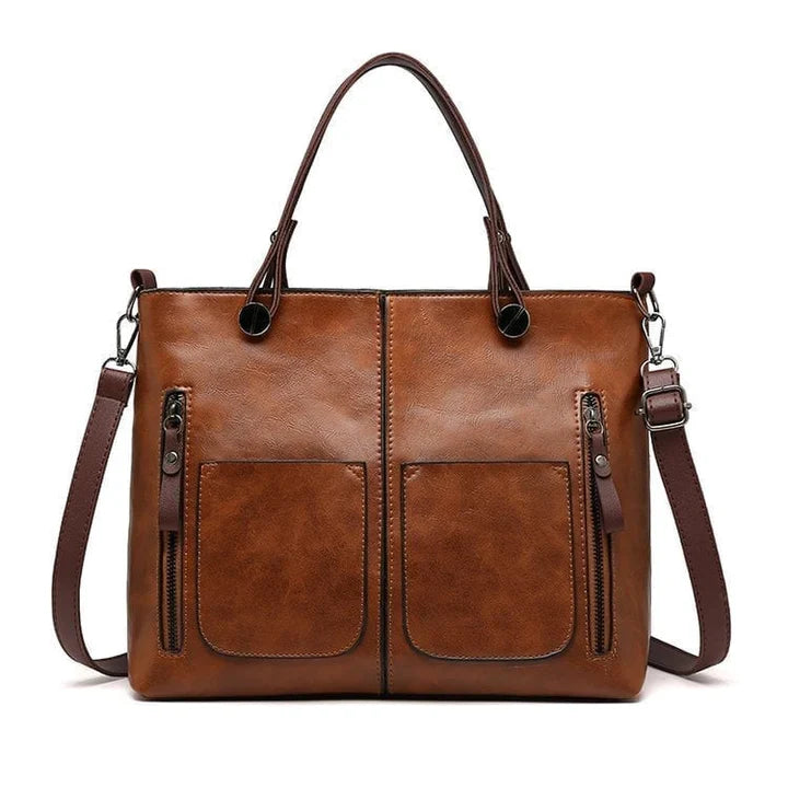 "Elegante vintagestijl leren schoudertas voor dames met bruine tinten, perfect voor een klassieke en tijdloze look."