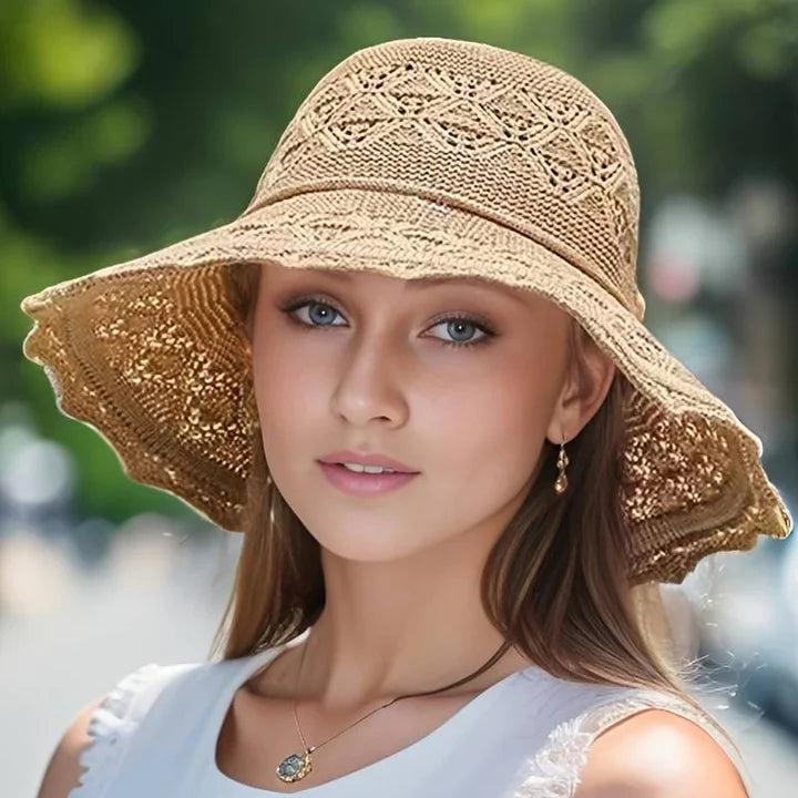 "Elegante zonnehoed met brede rand voor UV-bescherming, stijlvolle zomerse accessoire, beige kleur, lichtgewicht ontwerp."