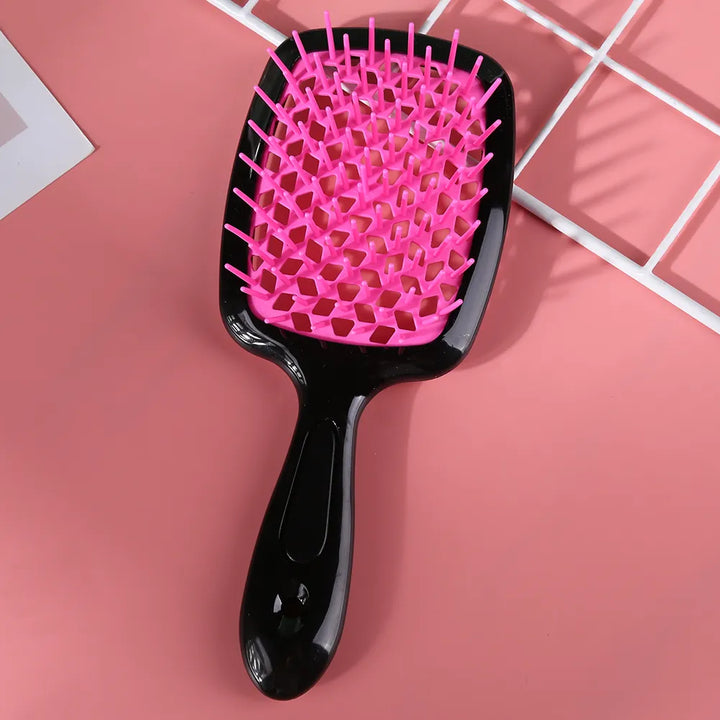 "Ergonomische ontwarring borstel met luchtkussen, bevordert snelle droging en pijnloze knoopverwijdering voor alle haartypes.