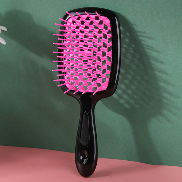 "Ergonomische ontwarring borstel met luchtkussen, bevordert snelle droging en pijnloze knoopverwijdering voor alle haartypes.