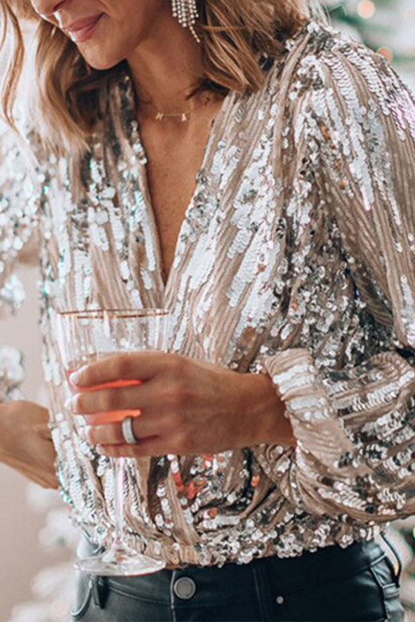 "Glamour blouse met glinsterende pailletten, V-hals en ballonmouwen, perfect voor feestelijke avonden en speciale gelegenhede