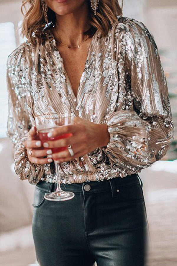"Glamour blouse met glinsterende pailletten, V-hals en ballonmouwen, perfect voor feestelijke avonden en speciale gelegenhede