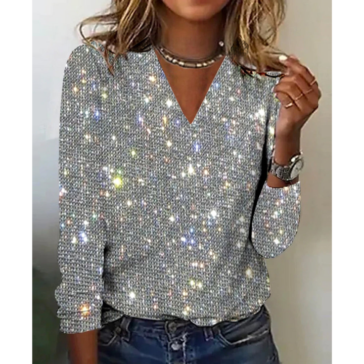 "Glamoureuze dames glitter blouse met sprankelende pailletten en V-hals, ideaal voor feestelijke gelegenheden."