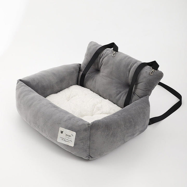 "Grijze honden autostoel, veilig en comfortabel. Zachte bekleding, waterafstotend, eenvoudig te installeren. Ideaal voor auto
