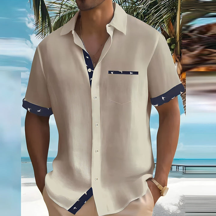 Heren overhemd met korte mouwen en een kleurrijke vogelprint, perfect voor de zomer en ideaal voor casual gelegenheden.