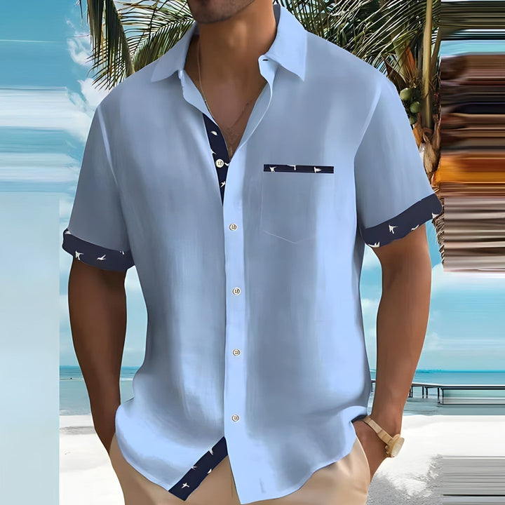 Heren overhemd met korte mouwen en een kleurrijke vogelprint, perfect voor de zomer en ideaal voor casual gelegenheden.