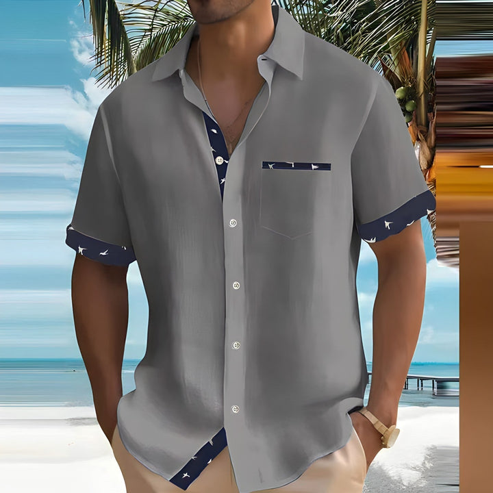 Heren overhemd met korte mouwen en een kleurrijke vogelprint, perfect voor de zomer en ideaal voor casual gelegenheden.