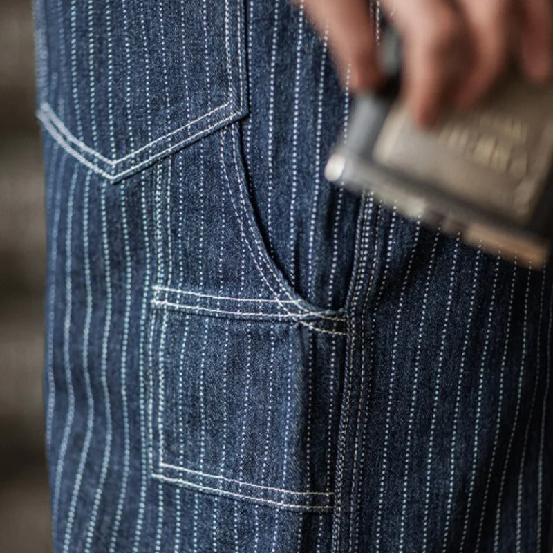 "Indigo denim overalls heren, vintage stijl, zes zakken, slanke pasvorm, hoge duurzaamheid, ademend katoen."