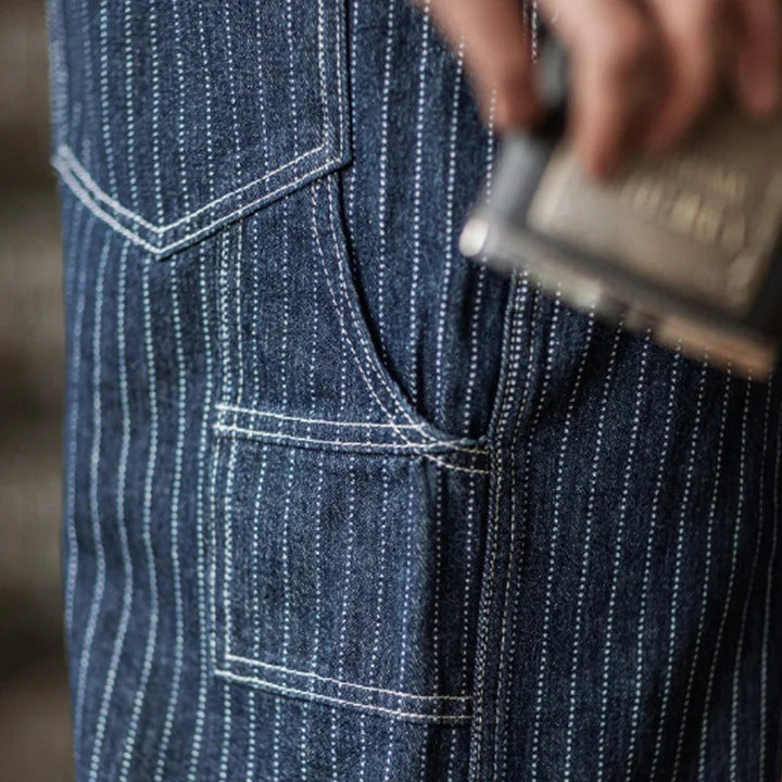 "Indigo denim overalls heren, vintage stijl, zes zakken, slanke pasvorm, hoge duurzaamheid, ademend katoen."