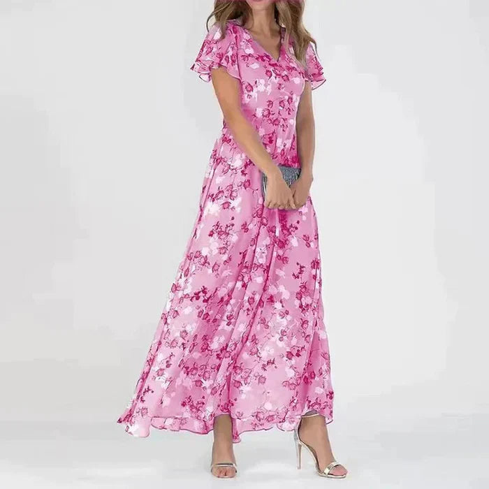 Lange zomerjurk met levendige bloemenprint, luchtig en stijlvol maxi-model, ideaal voor zonnige dagen en zomerse uitstapjes.