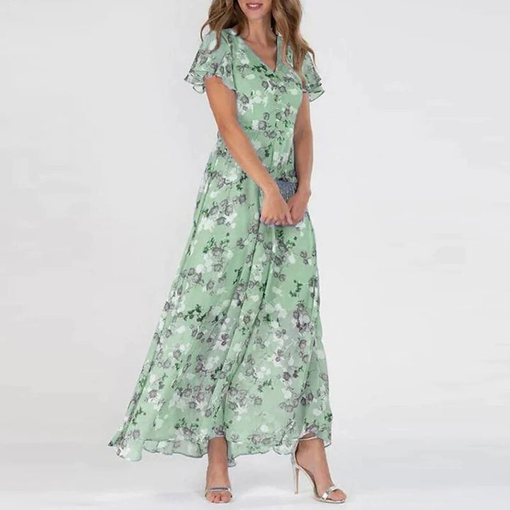 Lange zomerjurk met levendige bloemenprint, luchtig en stijlvol maxi-model, ideaal voor zonnige dagen en zomerse uitstapjes.