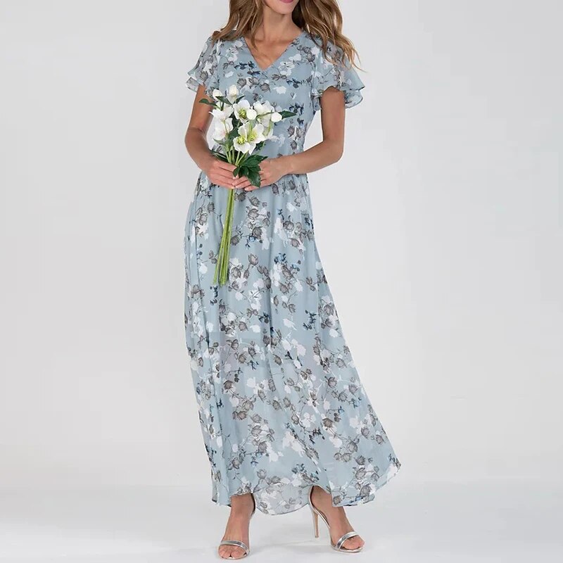 Lange zomerjurk met levendige bloemenprint, luchtig en stijlvol maxi-model, ideaal voor zonnige dagen en zomerse uitstapjes.