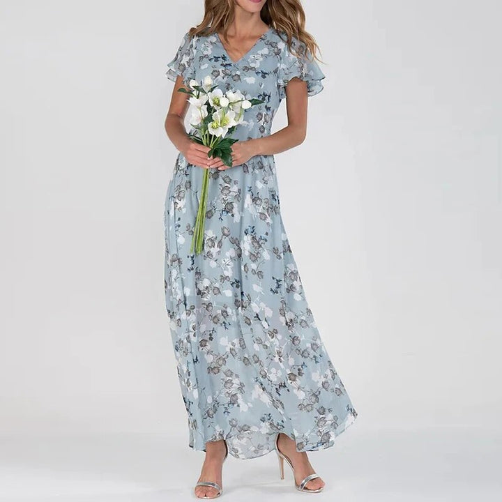 Lange zomerjurk met levendige bloemenprint, luchtig en stijlvol maxi-model, ideaal voor zonnige dagen en zomerse uitstapjes.
