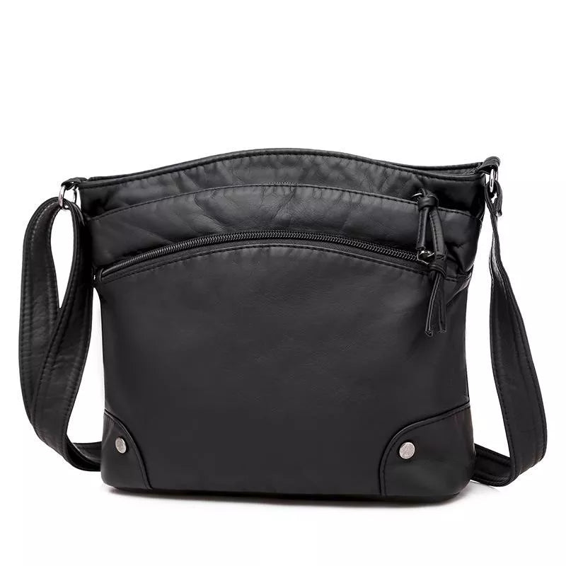 Leren schoudertas met kras- en waterbestendig leer, verstelbare riem; elegante tas voor dagelijks gebruik, zijaanzicht.