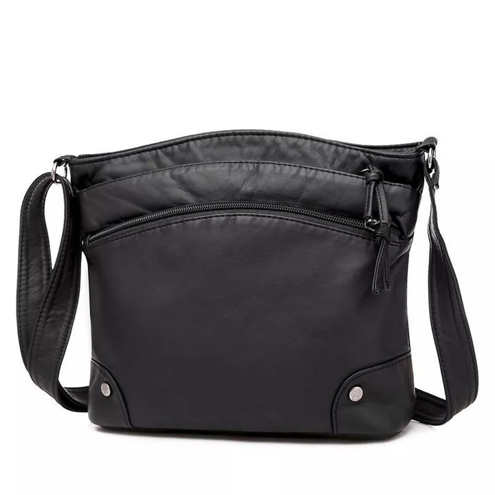 Leren schoudertas met kras- en waterbestendig leer, verstelbare riem; elegante tas voor dagelijks gebruik, zijaanzicht.