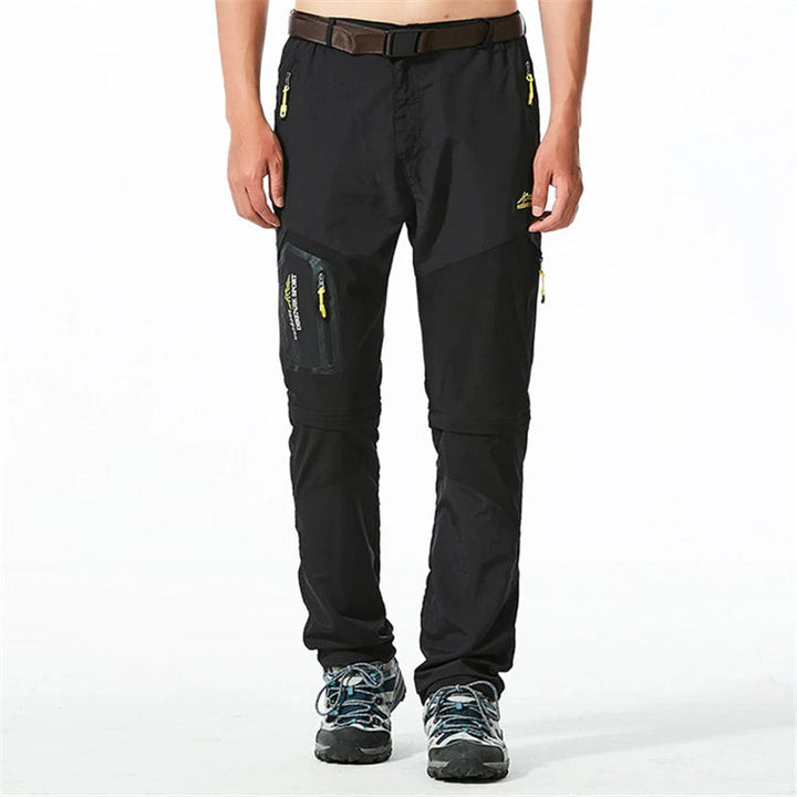 "Lichtgewicht heren outdoorbroek met afritsbare pijpen, sneldrogend en ademend, ideaal voor avontuurlijke zomerdagen."