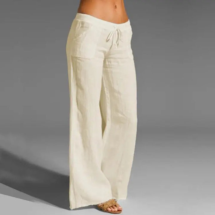 "Linnen dames zomerbroek met comfortabele pasvorm, chic design, luchtig en stijlvol, verkrijgbaar in neutrale kleuren."