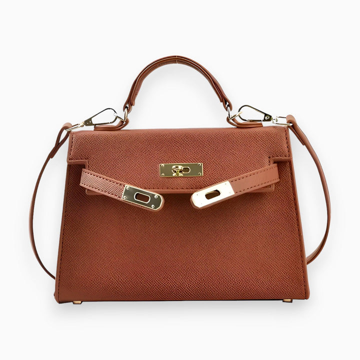 Luxe dameshandtas met glanzende metalen sluiting, strakke vormen, en stijlvolle structuur voor een elegante uitstraling.