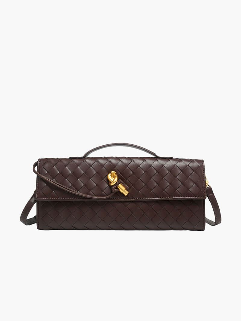 "Luxe geweven handtas in zwart met gouden sluiting, elegant en stijlvol ontwerp voor dames, ideaal voor elke gelegenheid."
