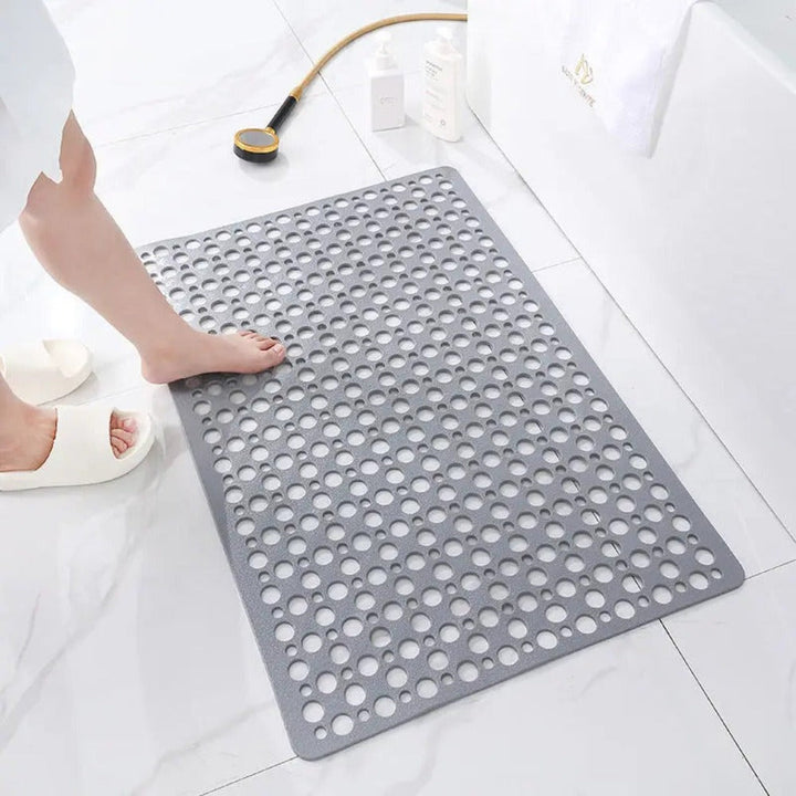 "Luxe grijze antislip douchemat met veilige zuignappen, schimmelbestendig design en efficiënt drainagesysteem voor hygiëne."