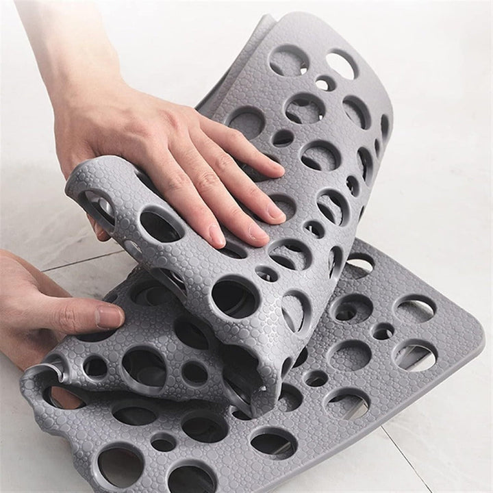 "Luxe grijze antislip douchemat met veilige zuignappen, schimmelbestendig design en efficiënt drainagesysteem voor hygiëne."