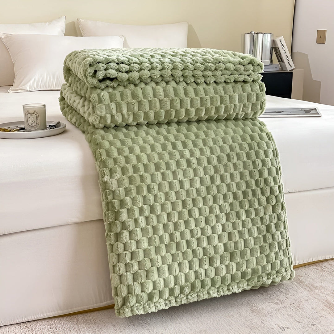 "Luxe microfleece deken in neutrale kleur, zacht en warm. Perfect als decoratieve bankdeken of bedsprei voor elk interieur."