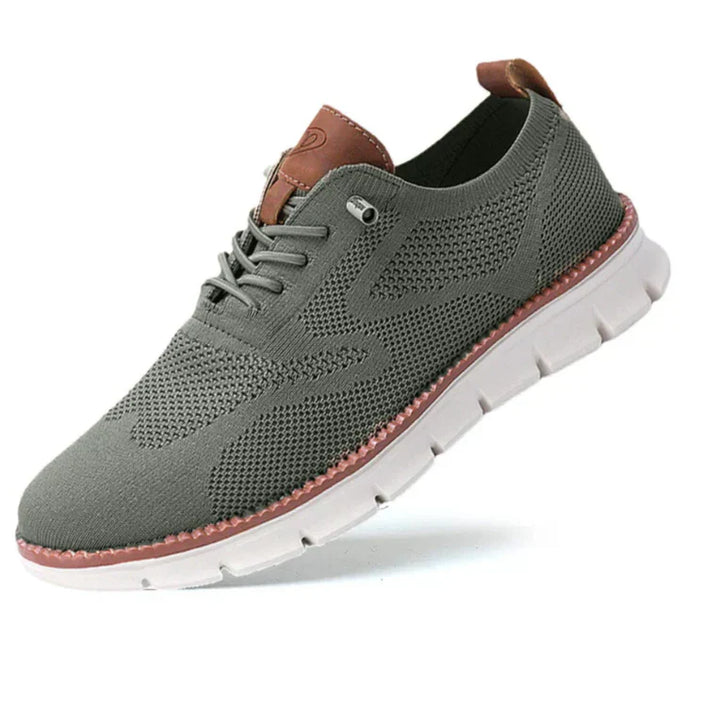 "Mesh sneakers voor heren, ademend en flexibel, in olijfgroen. Comfortabel met luchtig ontwerp en schokabsorberende zool."