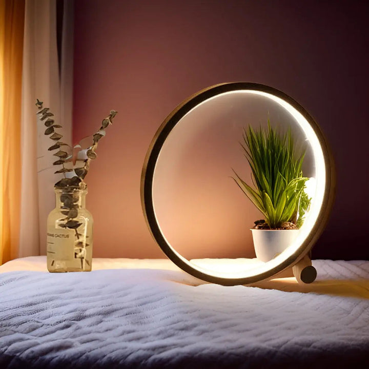 "Minimalistische dimbare LED tafellamp met elegant, eigentijds design en ronde vorm voor moderne interieurs."