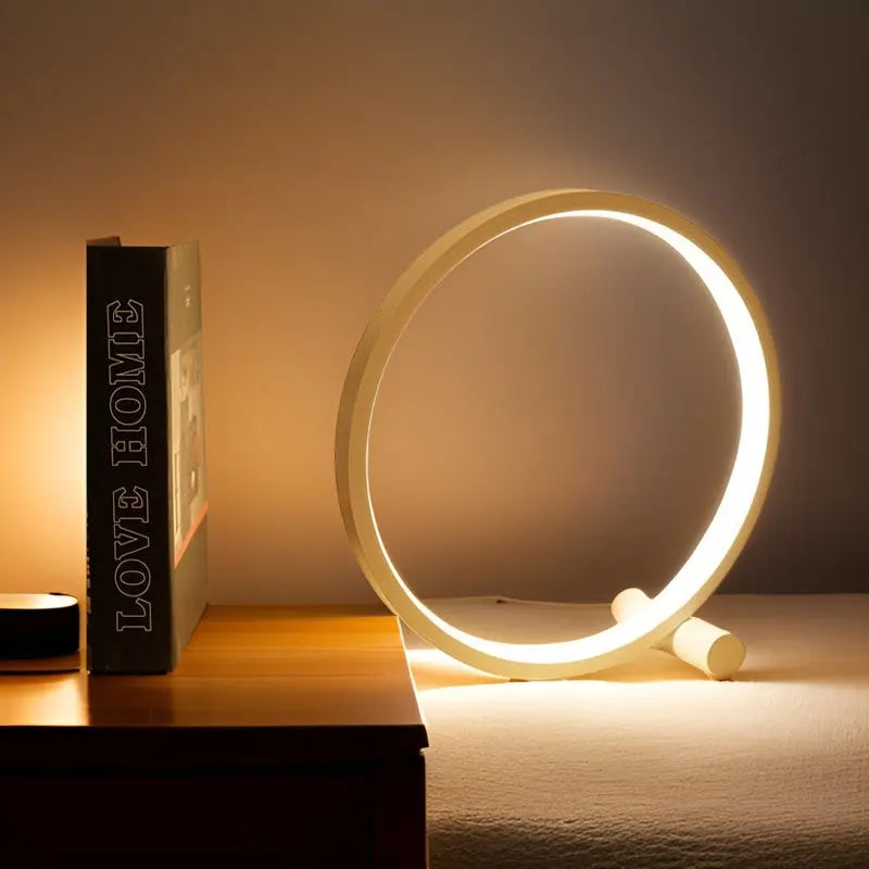 "Minimalistische dimbare LED tafellamp met elegant, eigentijds design en ronde vorm voor moderne interieurs."