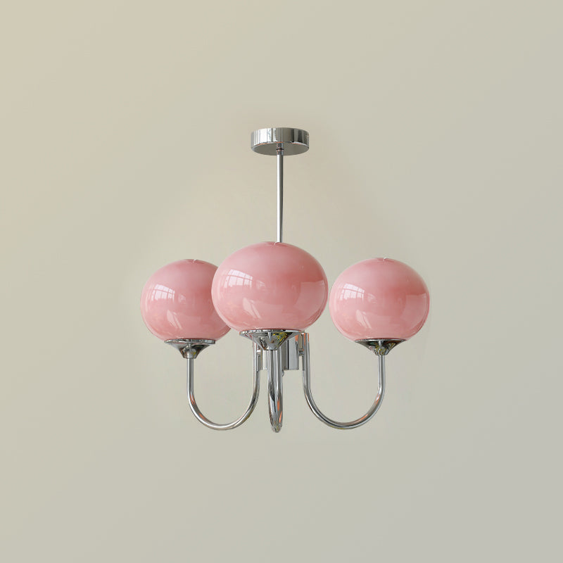 "Moderne kroonluchter met gouden afwerking en roze glazen kappen, geschikt voor LED verlichting in eigentijds interieur."