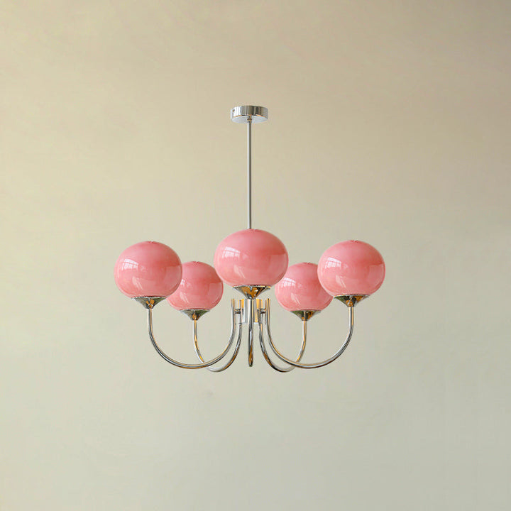 "Moderne kroonluchter met gouden afwerking en roze glazen kappen, geschikt voor LED verlichting in eigentijds interieur."