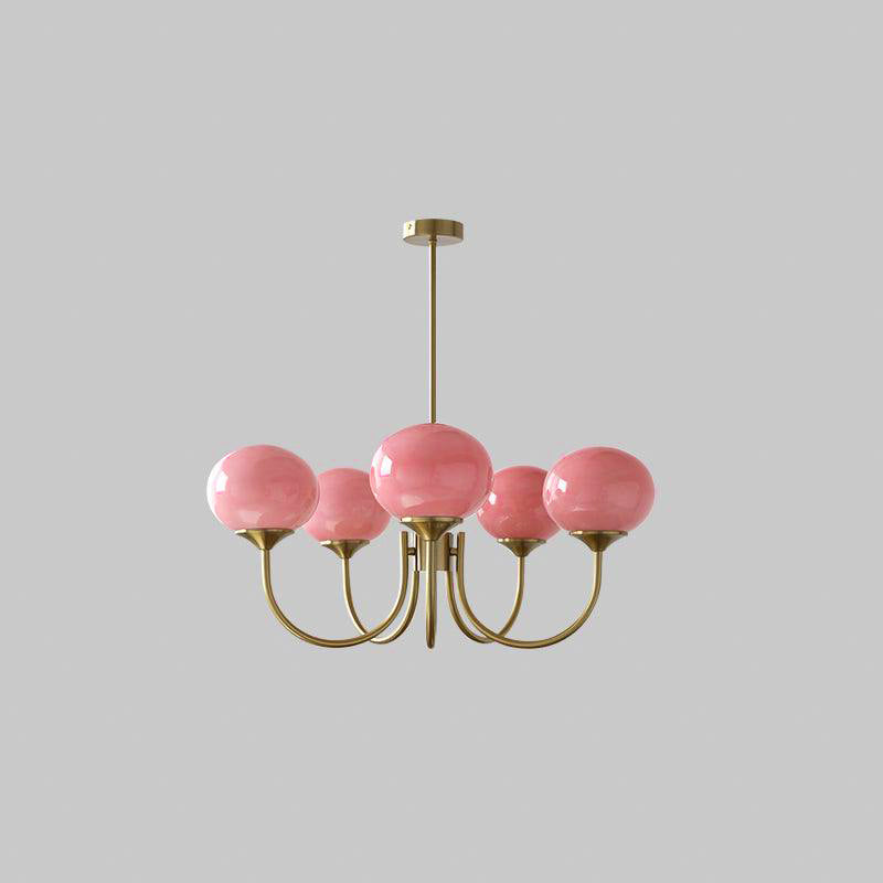 "Moderne kroonluchter met gouden afwerking en roze glazen kappen, geschikt voor LED verlichting in eigentijds interieur."