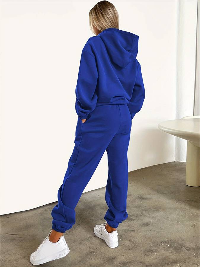 "Neutral beige loungewear set dames, oversized sweater en joggingbroek, grafische print, elastische tailleband voor comfort."
