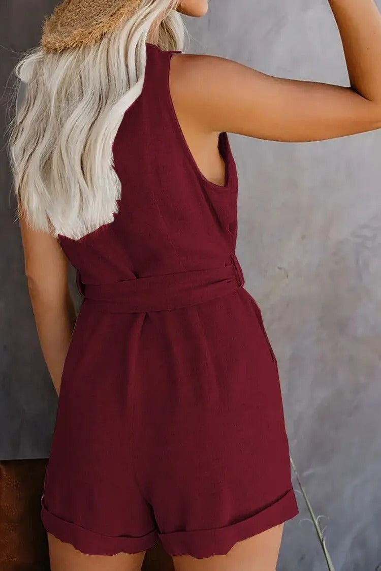 "Nina jumpsuit met V-hals, knoopriem en zakken, zachte stretchstof, elegant en comfortabel, perfect voor elke gelegenheid"