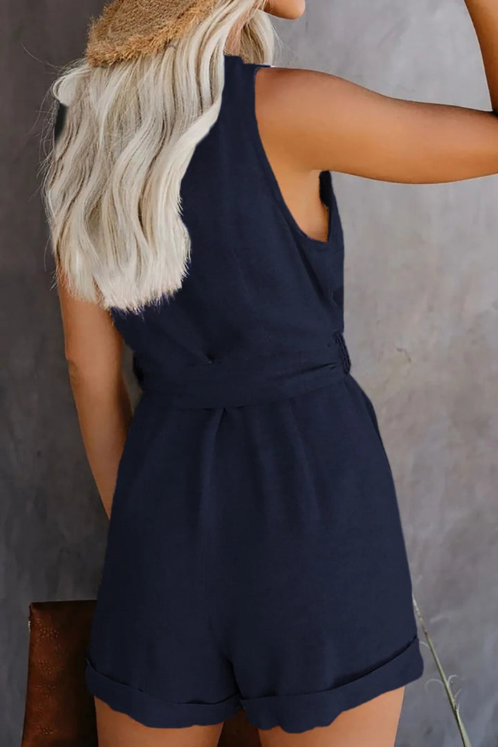 "Nina jumpsuit met V-hals, knoopriem en zakken, zachte stretchstof, elegant en comfortabel, perfect voor elke gelegenheid"