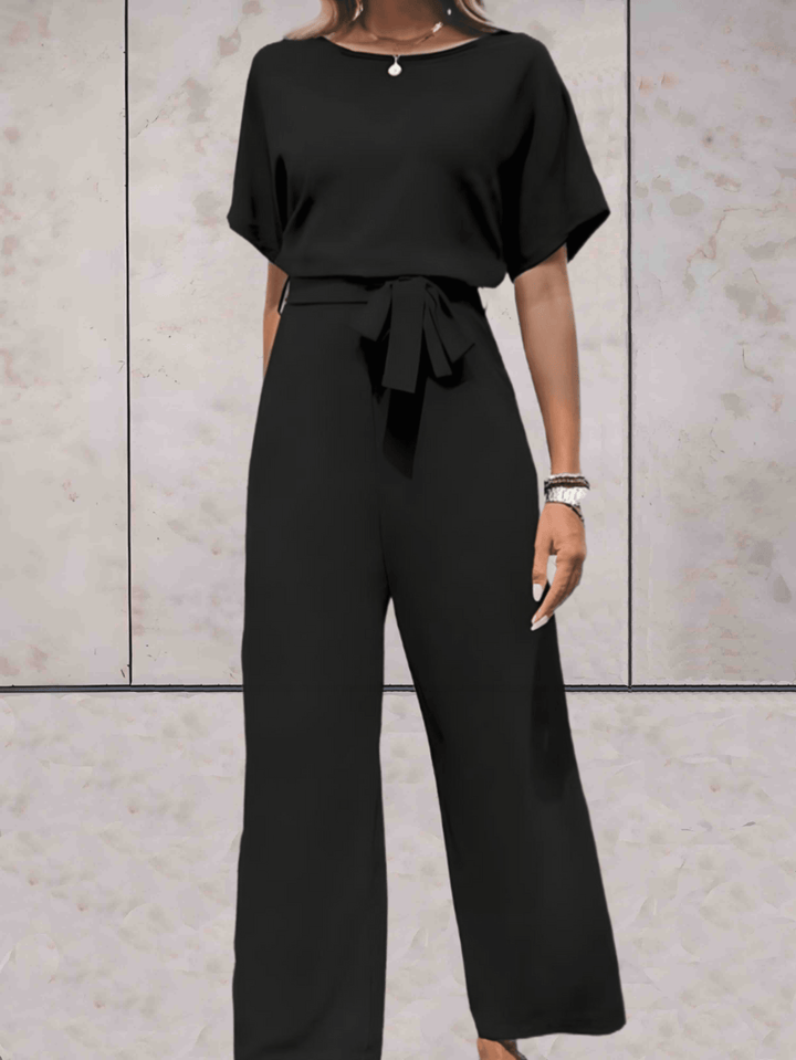 "Noa jumpsuit dames in stijlvol design, luchtige stof, elegante uitstraling met wijde mouwen en speelse details."