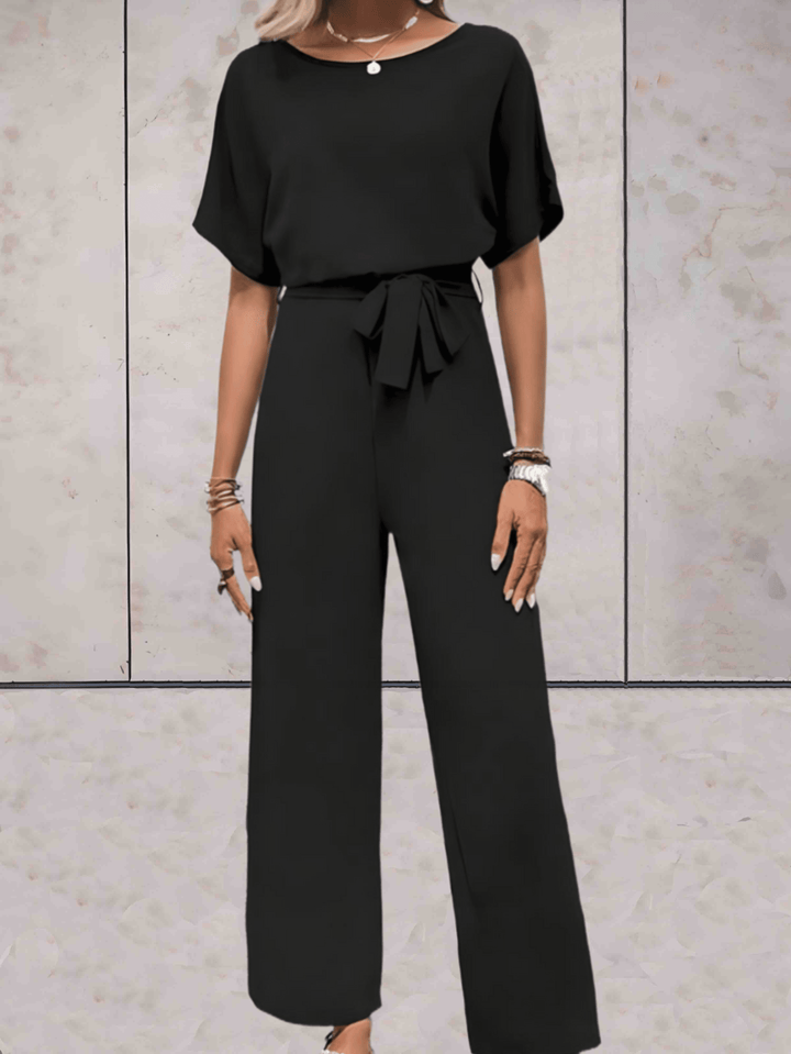 "Noa jumpsuit dames in stijlvol design, luchtige stof, elegante uitstraling met wijde mouwen en speelse details."