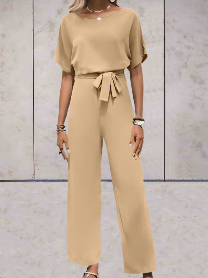 "Noa jumpsuit dames in stijlvol design, luchtige stof, elegante uitstraling met wijde mouwen en speelse details."