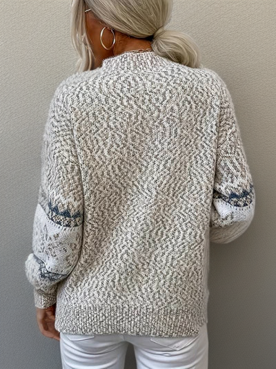 "Noorse wollen trui voor dames, Scandinavische stijl met sneeuwvlokkenmotief, warmte en elegantie."