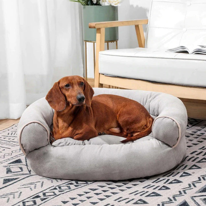 Orthopedische hondenbank met dikke vulling, grijze stof, verhoogde randen; biedt luxueus comfort en ondersteuning aan je hond