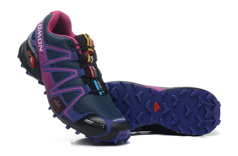 "Robuuste Solamon wandelsneakers met antislipzool en stevige constructie, in wit en zwart, ideaal voor avonturen."