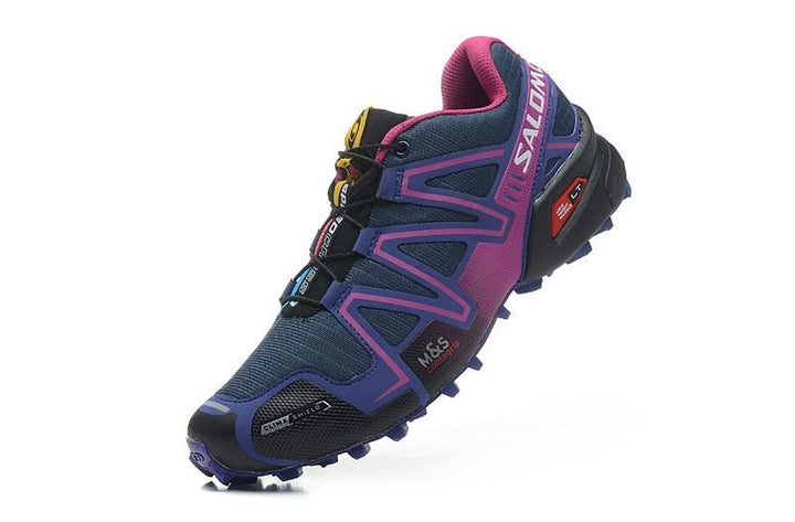"Robuuste Solamon wandelsneakers met antislipzool en stevige constructie, in wit en zwart, ideaal voor avonturen."