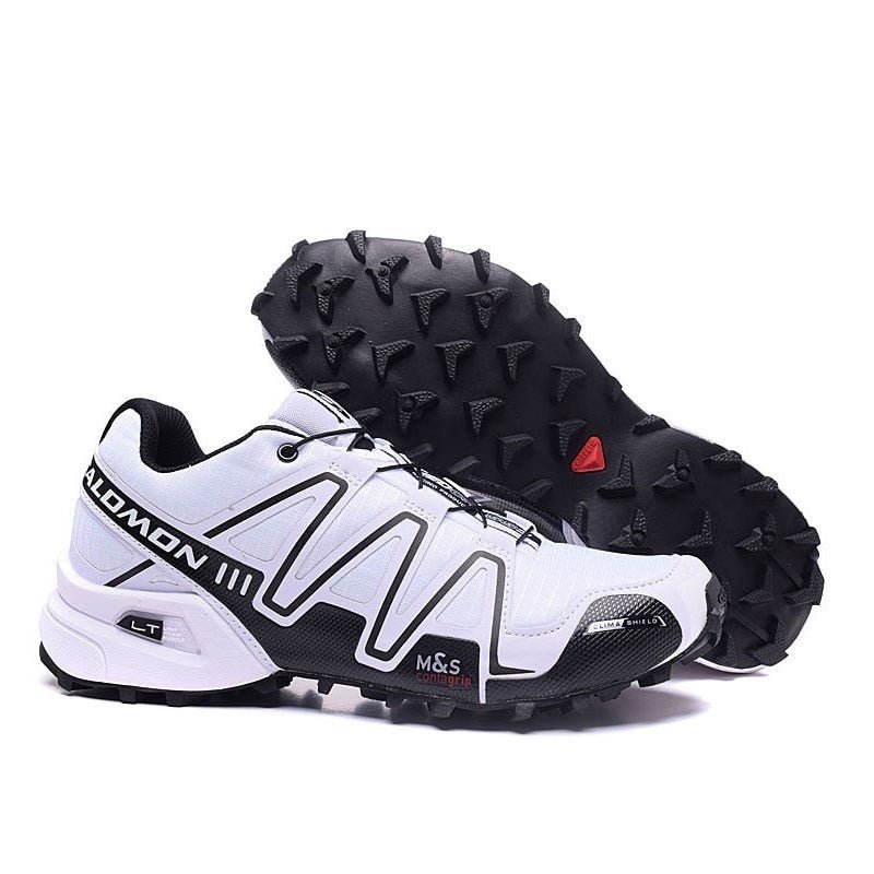 "Robuuste Solamon wandelsneakers met antislipzool en stevige constructie, in wit en zwart, ideaal voor avonturen."
