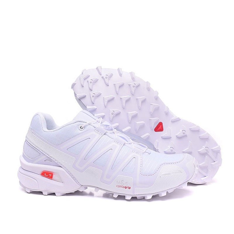 "Robuuste Solamon wandelsneakers met antislipzool en stevige constructie, in wit en zwart, ideaal voor avonturen."
