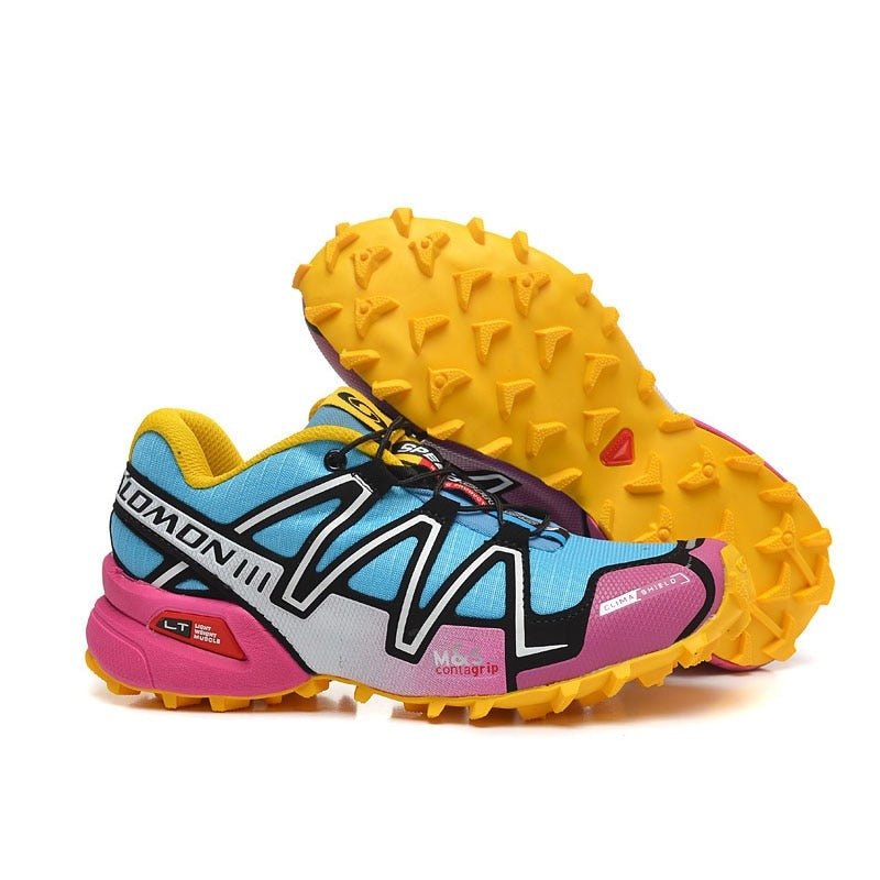 "Robuuste Solamon wandelsneakers met antislipzool en stevige constructie, in wit en zwart, ideaal voor avonturen."