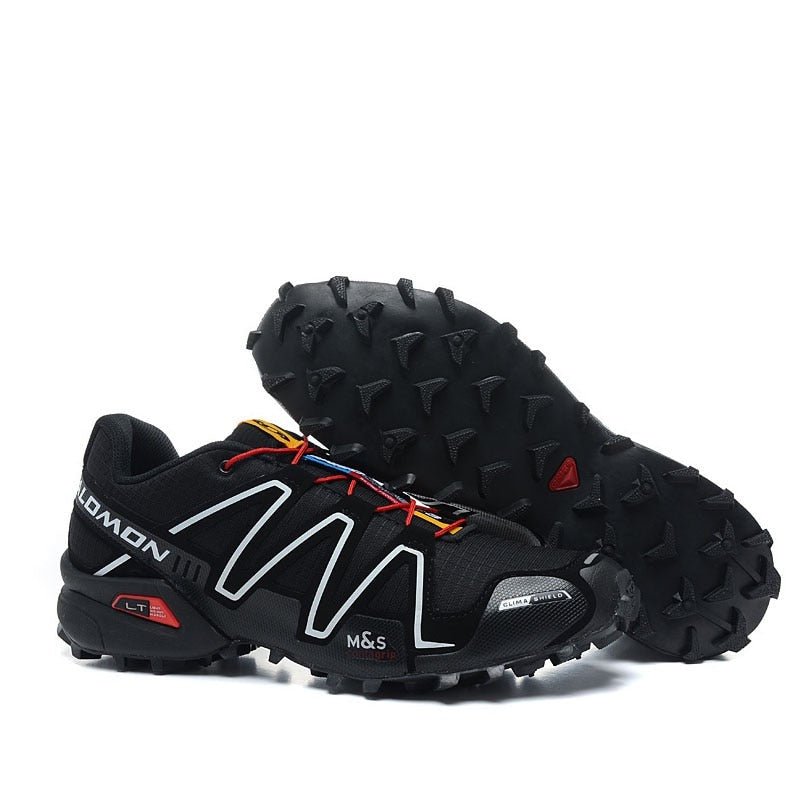 "Robuuste Solamon wandelsneakers met antislipzool en stevige constructie, in wit en zwart, ideaal voor avonturen."